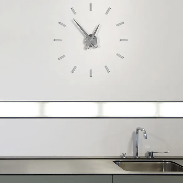 Nomon Puntos Suspensivos wall clock